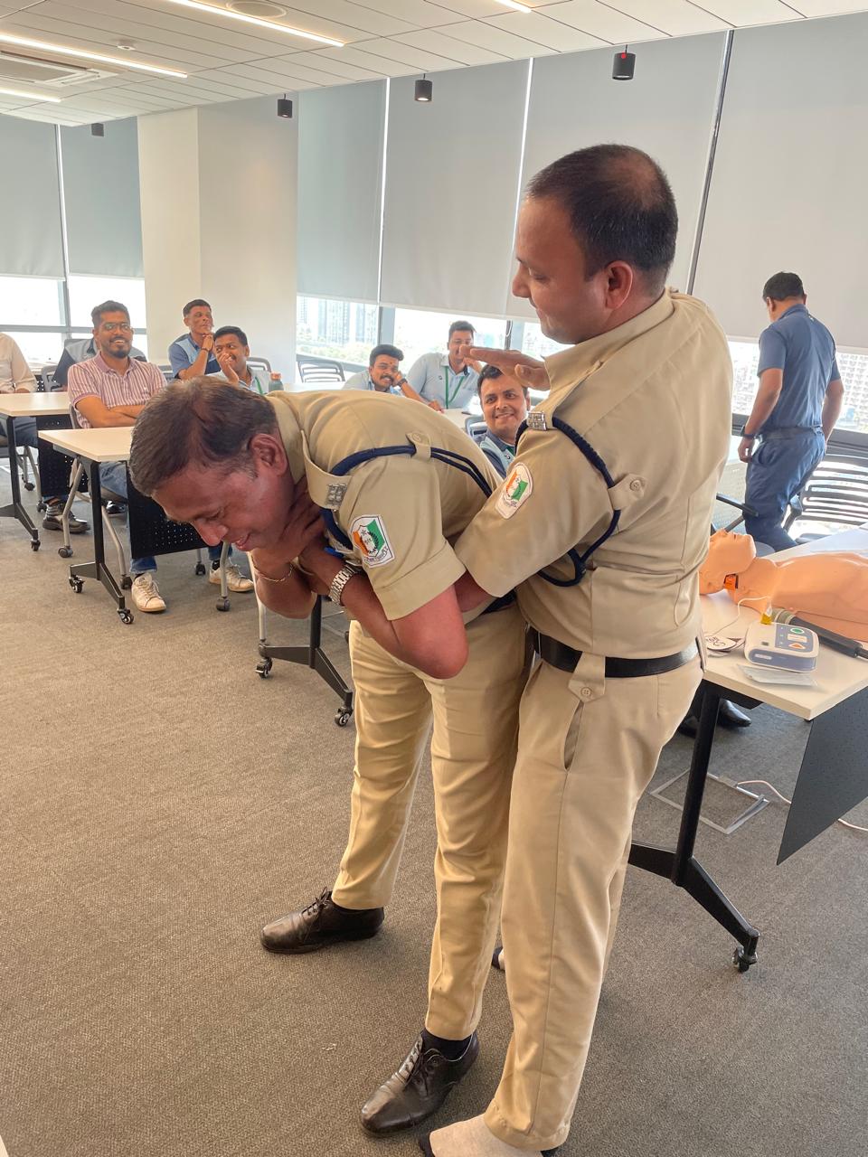Choking response demonstration with security staff