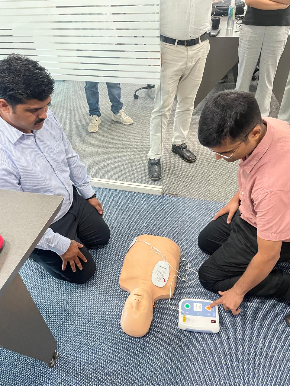 Learning to operate an AED trainer with pads attached to a mannequin