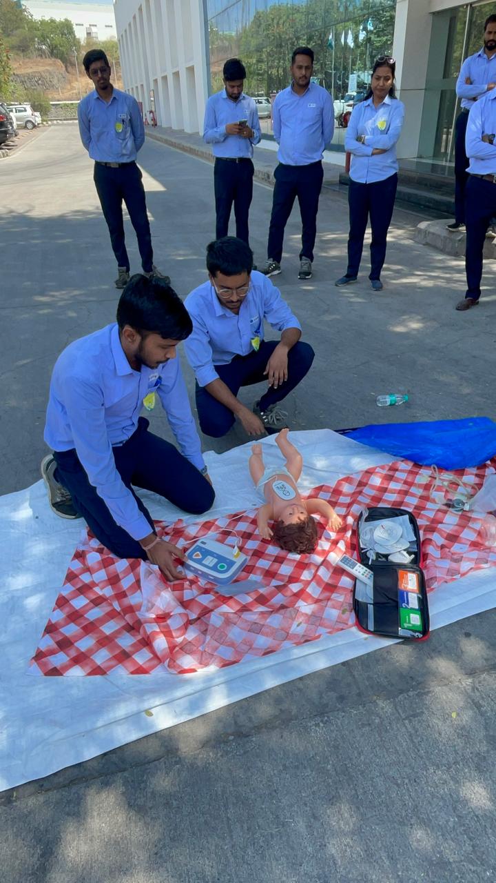 Infant AED and CPR practice during an onsite session